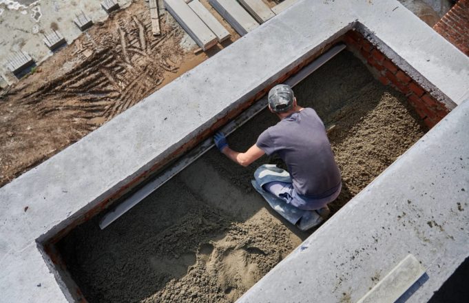 male working working on floor drain