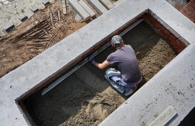 male working working on floor drain